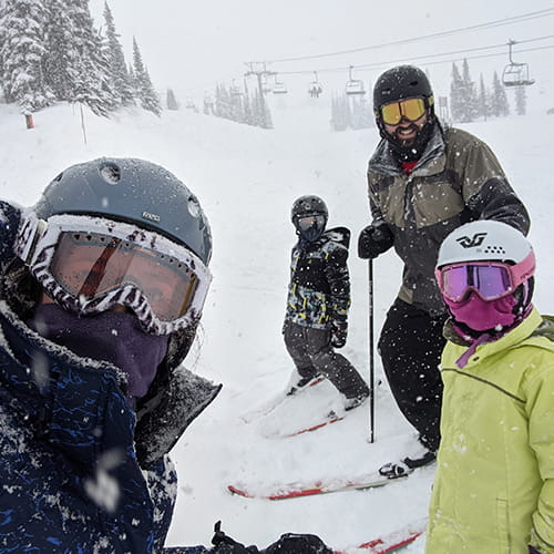 Daiva and her family skiing in the snow